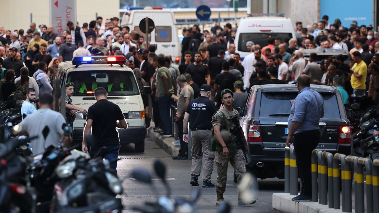 Ambulances are surrounded by people at the entrance of the American University of Beirut Medical Center, on September 17, 2024, after explosions hit locations in several Hezbollah strongholds around Lebanon amid ongoing cross-border tensions between Israel and Hezbollah fighters.